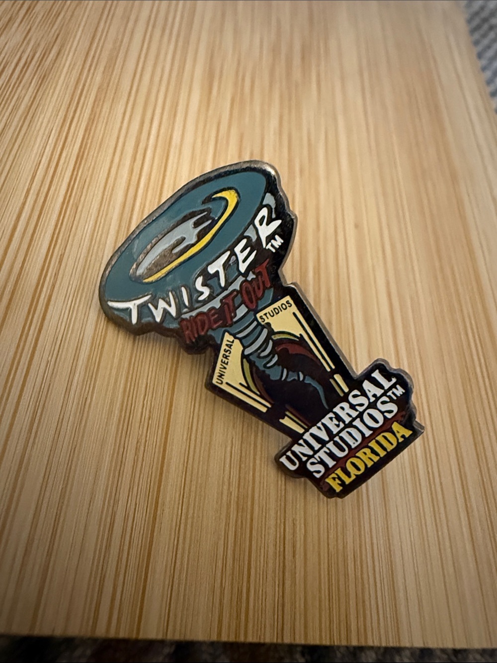 Universal Studios Florida Twister Ride It Out Enamel Pin - Teal, Yellow, Black